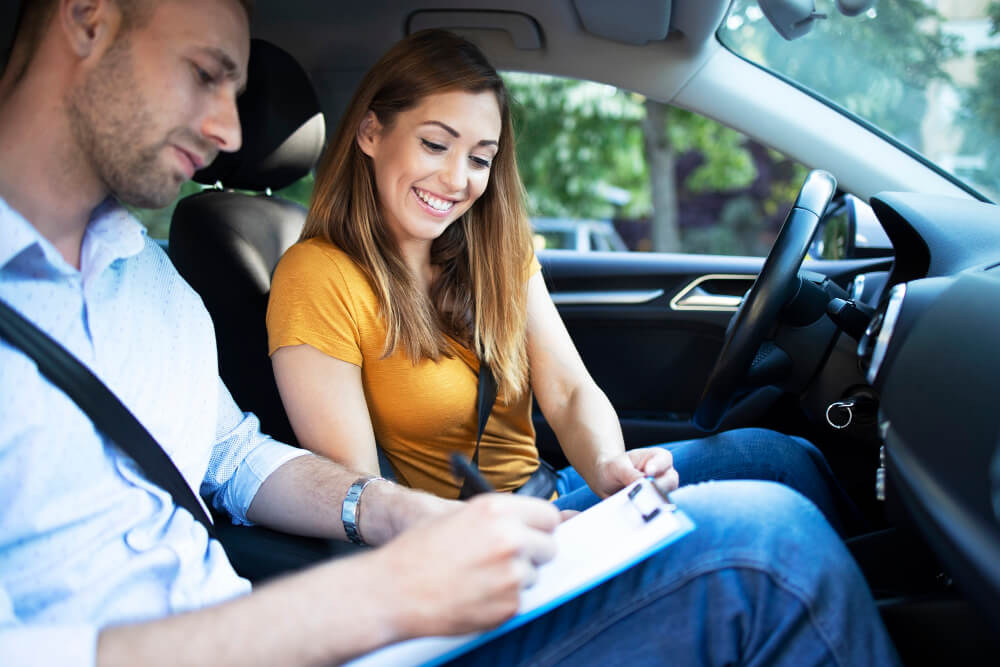 Car instructor explaining city traffic rules before driving a car Car instructor explaining city traffic rules before driving a car